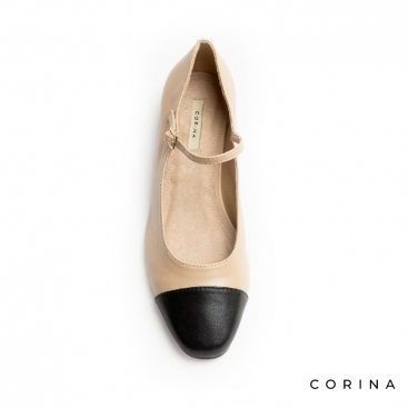 zapatos beige con punta negra chanel​