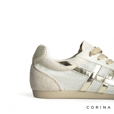 Detalle zapatilla Corina dorada retro