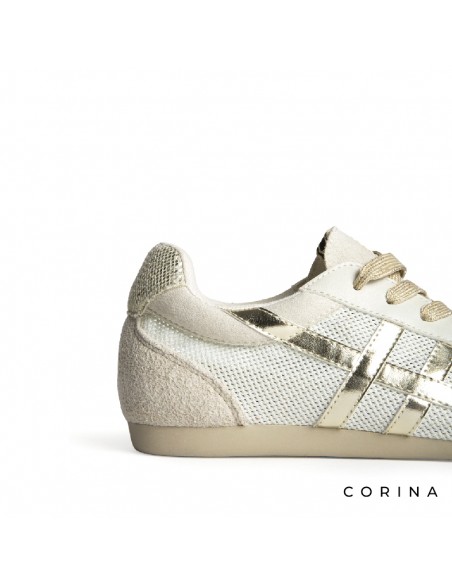 Detalle zapatilla Corina dorada retro