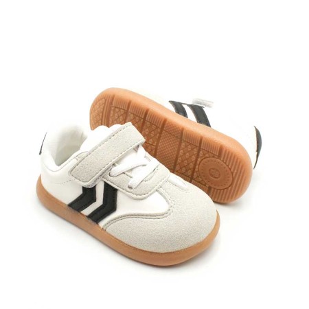 bambas de bebe​ blancas con rayas negras