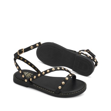 Sandalia niña negra con pulsera y hebilla ajustable.