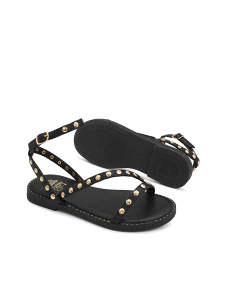 Sandalia niña negra con pulsera y hebilla ajustable.