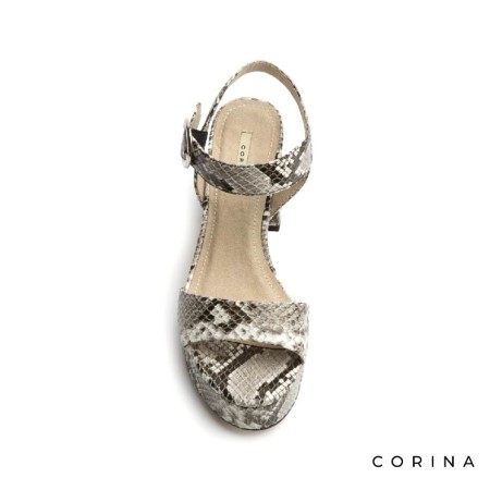 Vista frontal de sandalias serpiente de tacón ancho para mujer