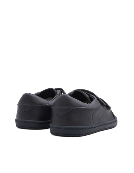 Colegial barefoot niño azul marino vista trasera